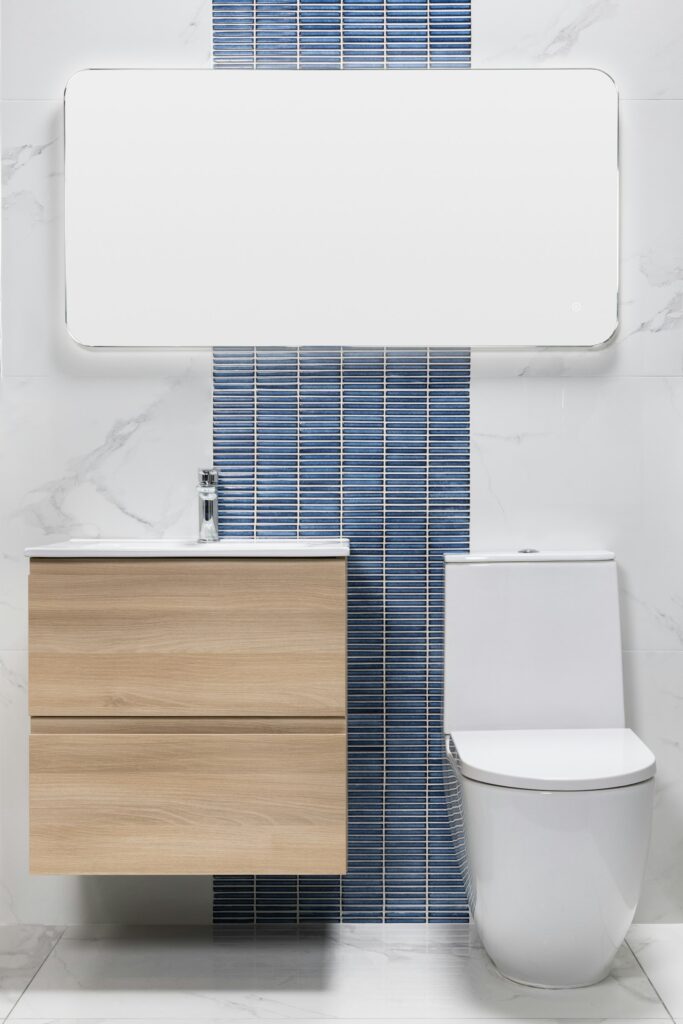 Remodeled bathroom with wooden vanity