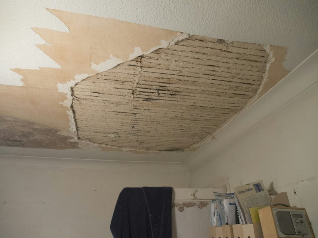 Water damaged ceiling removed during restoration